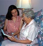 Two women sitting on couch